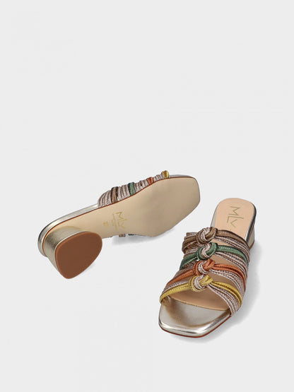 Multicolored metallic sandal with woven design on a light gray background