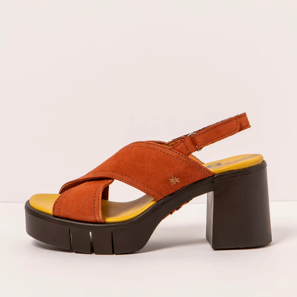 Side view of a dark orange sandal with a block heel on a light beige background