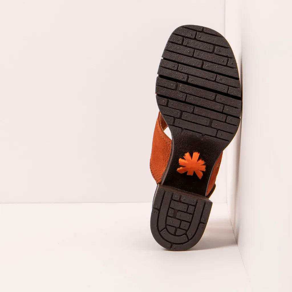 Close-up of a sandal sole with the ART brand logo on a white background