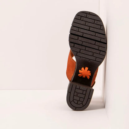 Close-up of a sandal sole with the ART brand logo on a white background