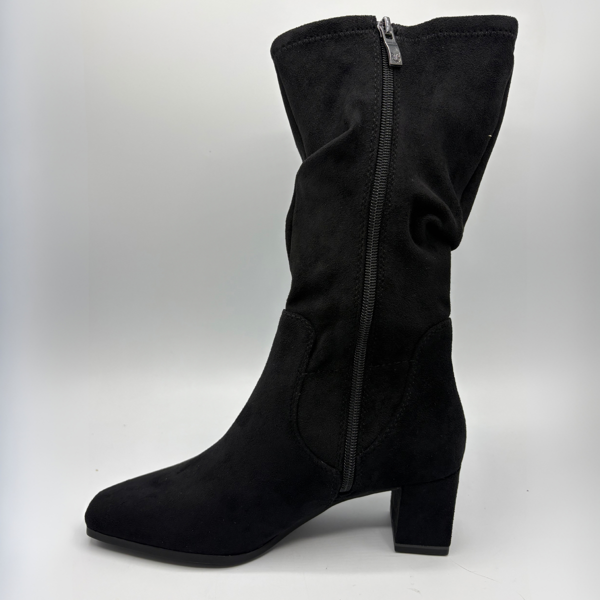 Left facing view of a black slouchy boot with a block heel