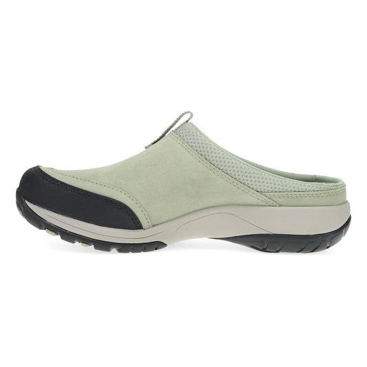 Light green clog shoe with black sole on a white background