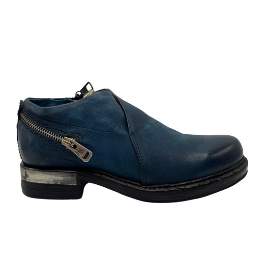 Right facing view of blue leather shoes with zipper heel accent and short heel