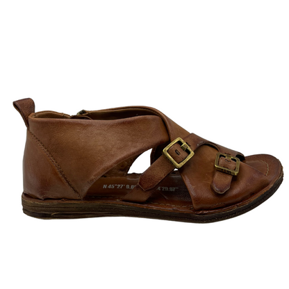 Right facing view of brown leather sandal with gold buckle straps