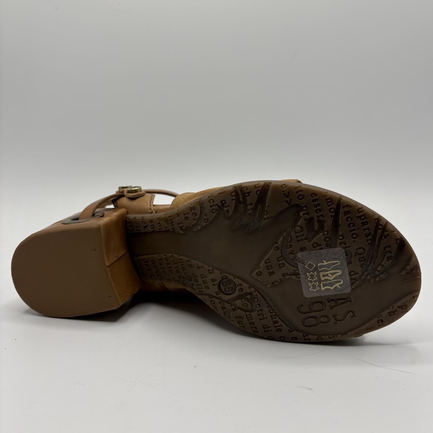 Brown sandal sole with brand logo on a white background