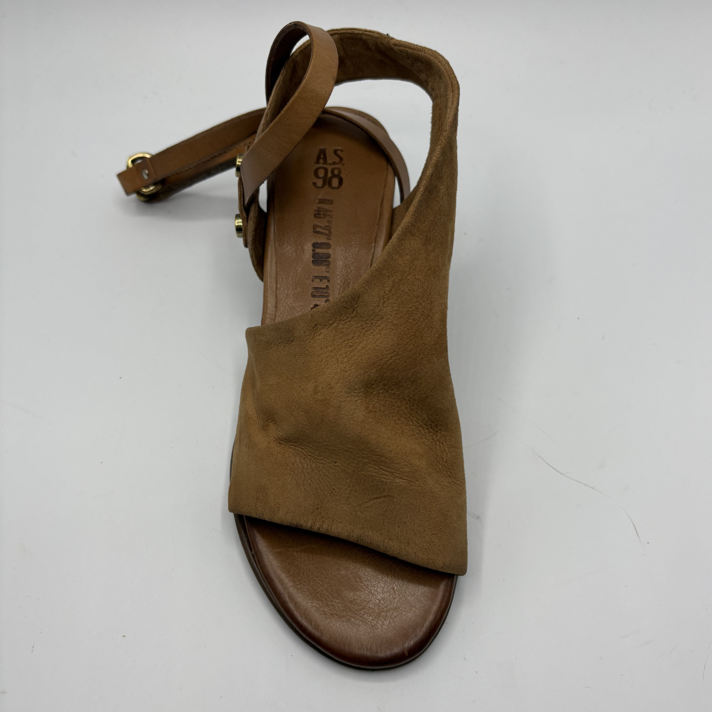 Brown sandal with a strap on a white background