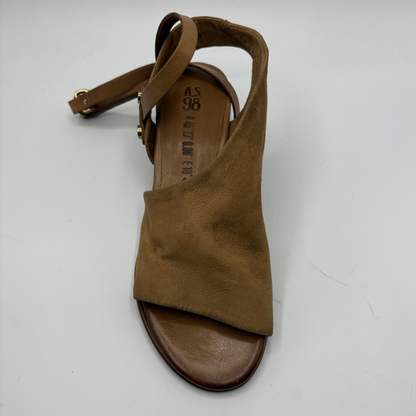 Brown sandal with a strap on a white background