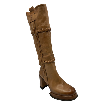 45 degree angled view of brown leather knee high boots with block heel and platform toe