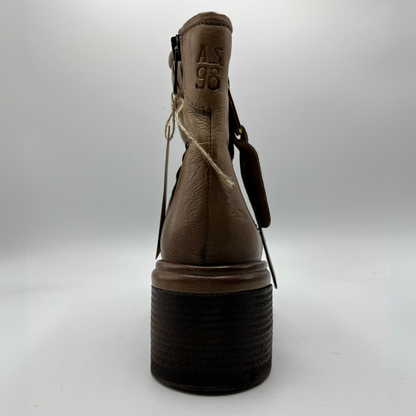 Brown boot with black sole on a white background