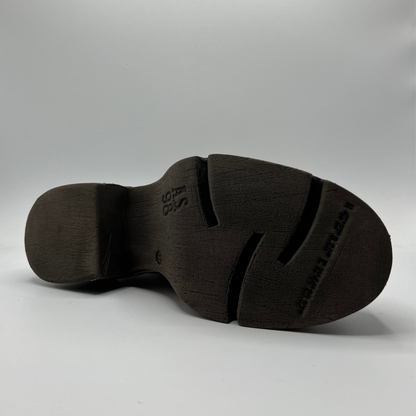 Black shoe sole on a gray background