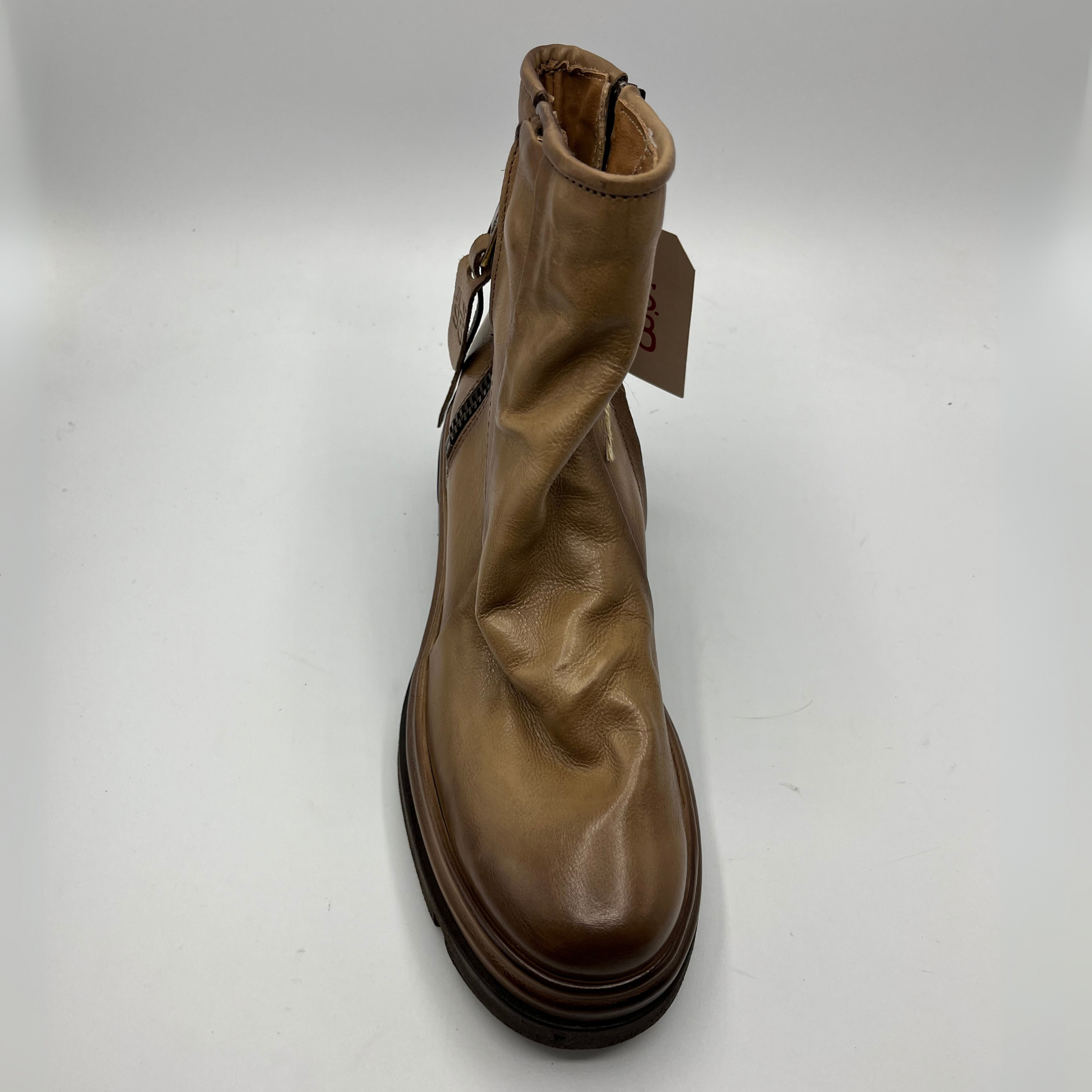 Brown leather boot on a white background