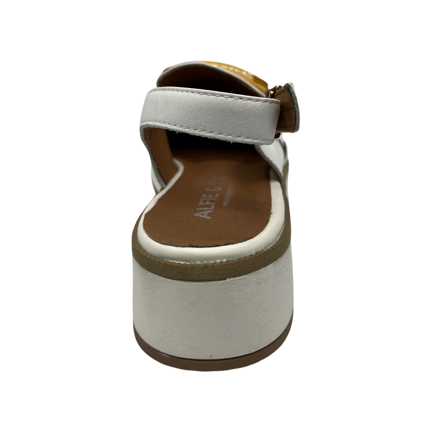 Back view of white leather slip on loafer with adjustable sling back strap, opaque square gold detail on upper and white wedge outsole.