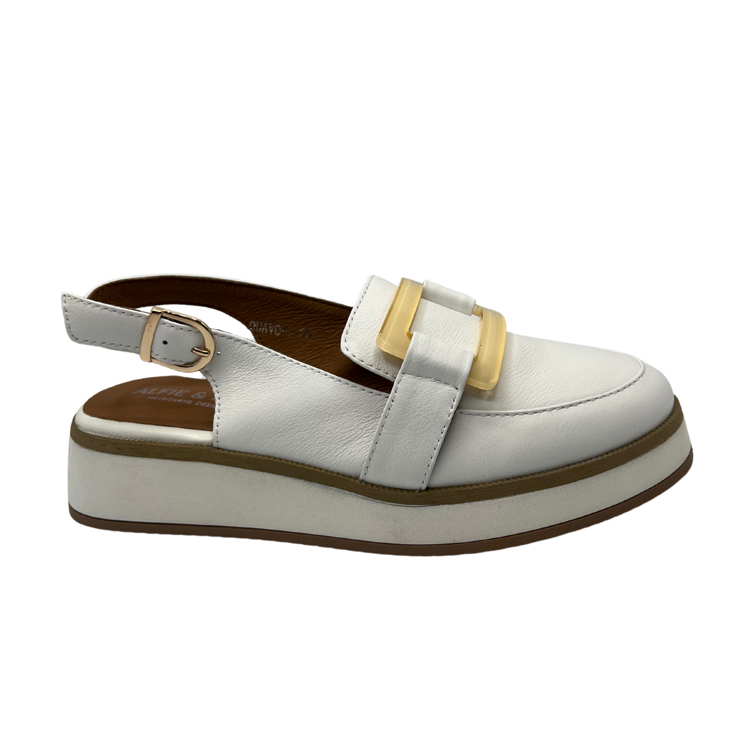 Right facing view of white leather slip on loafer with adjustable sling back strap, opaque square gold detail on upper and white wedge outsole.