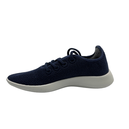 Left facing view of eucalyptus fiber running sneaker in a hazy indigo colour and white outsole.