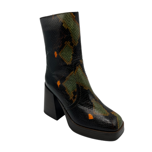 45 degree angled view of leather, snake print short boot. Chunky block heel, slightly squared toe and platform sole