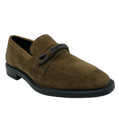 45 degree angled view of brown suede loafer with black outsole and silver detail on upper