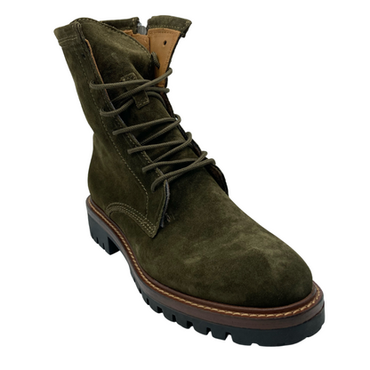 45 degree angled view of khaki green short boot with short heel and black treaded sole