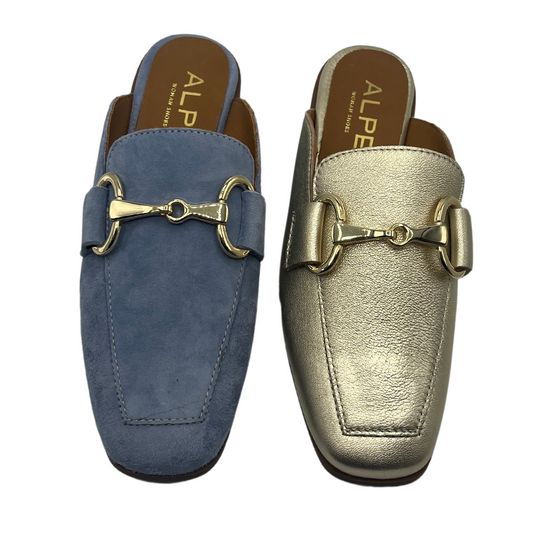 Top view of two slip on loafers side by side. One is blue and one is metallic. Both have gold bit details on the upper and brown lining.
