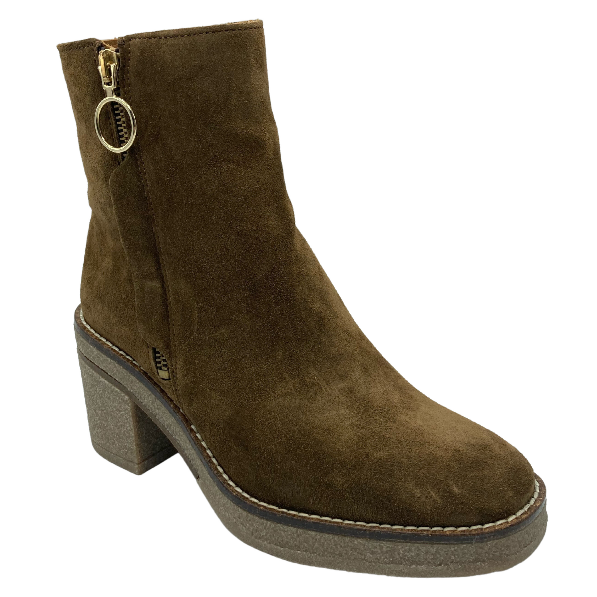 45 degree angled view of brown suede short boot with rubber sole and block heel