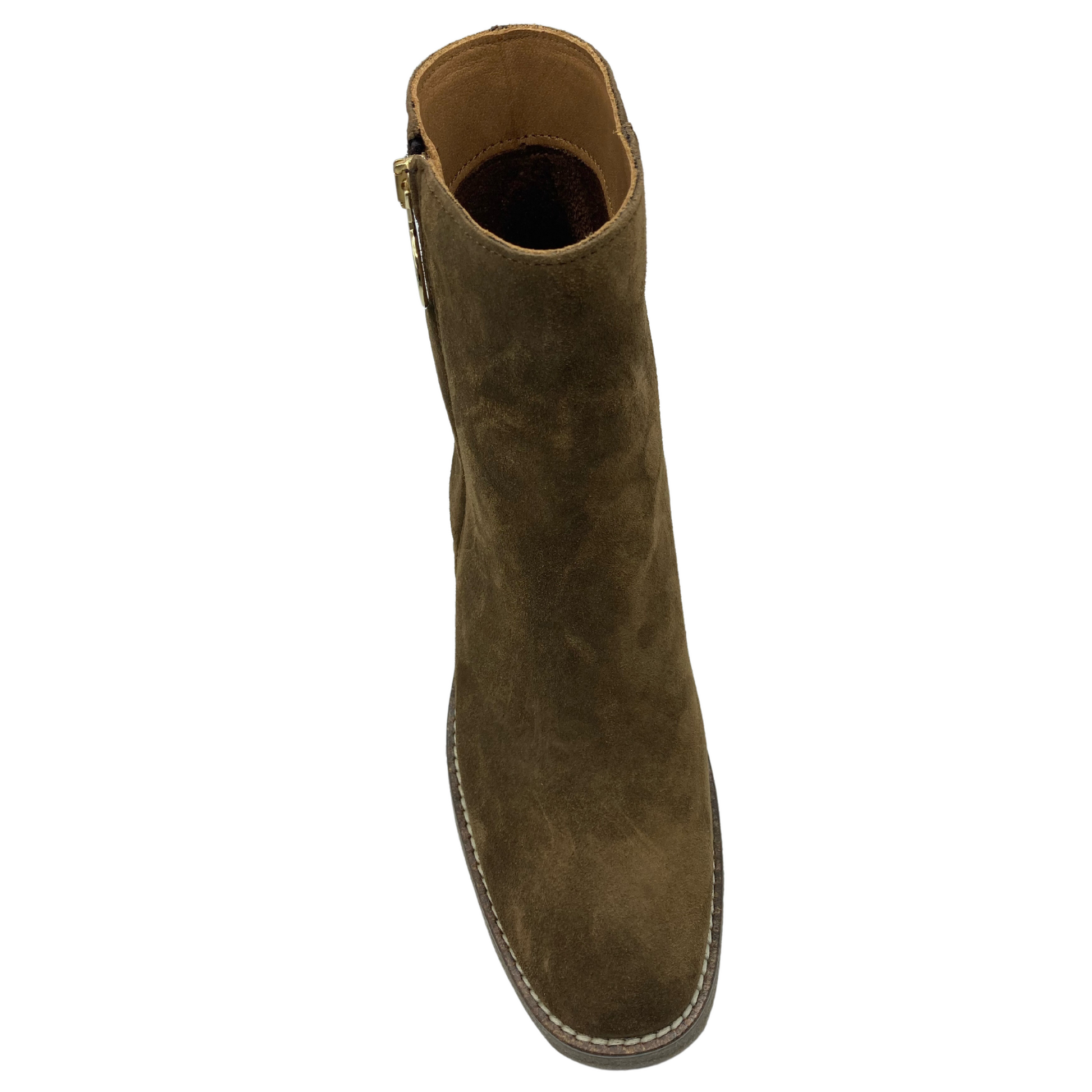 Top view of brown suede short boot with rounded toe and textile lining