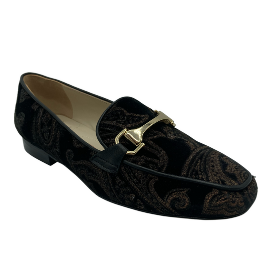 45 degree angled view of gold and brown patterned loafer with gold bit detail on upper
