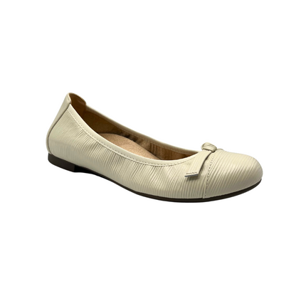 Angled front view of a cream color ballet flat