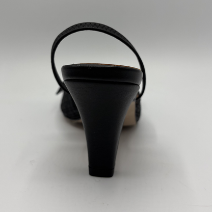 Black high-heeled sandal on a white background