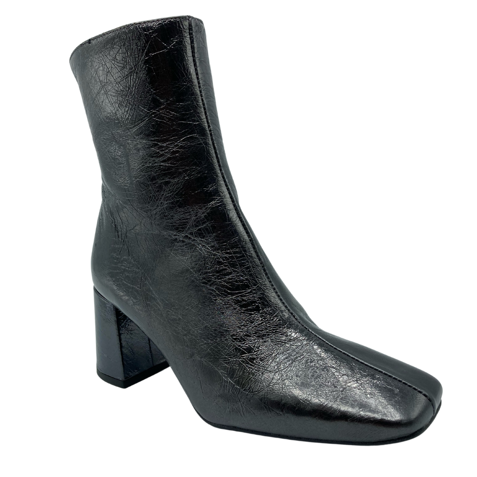 45 degree angled view of textured leather short boot with block heel and square toe