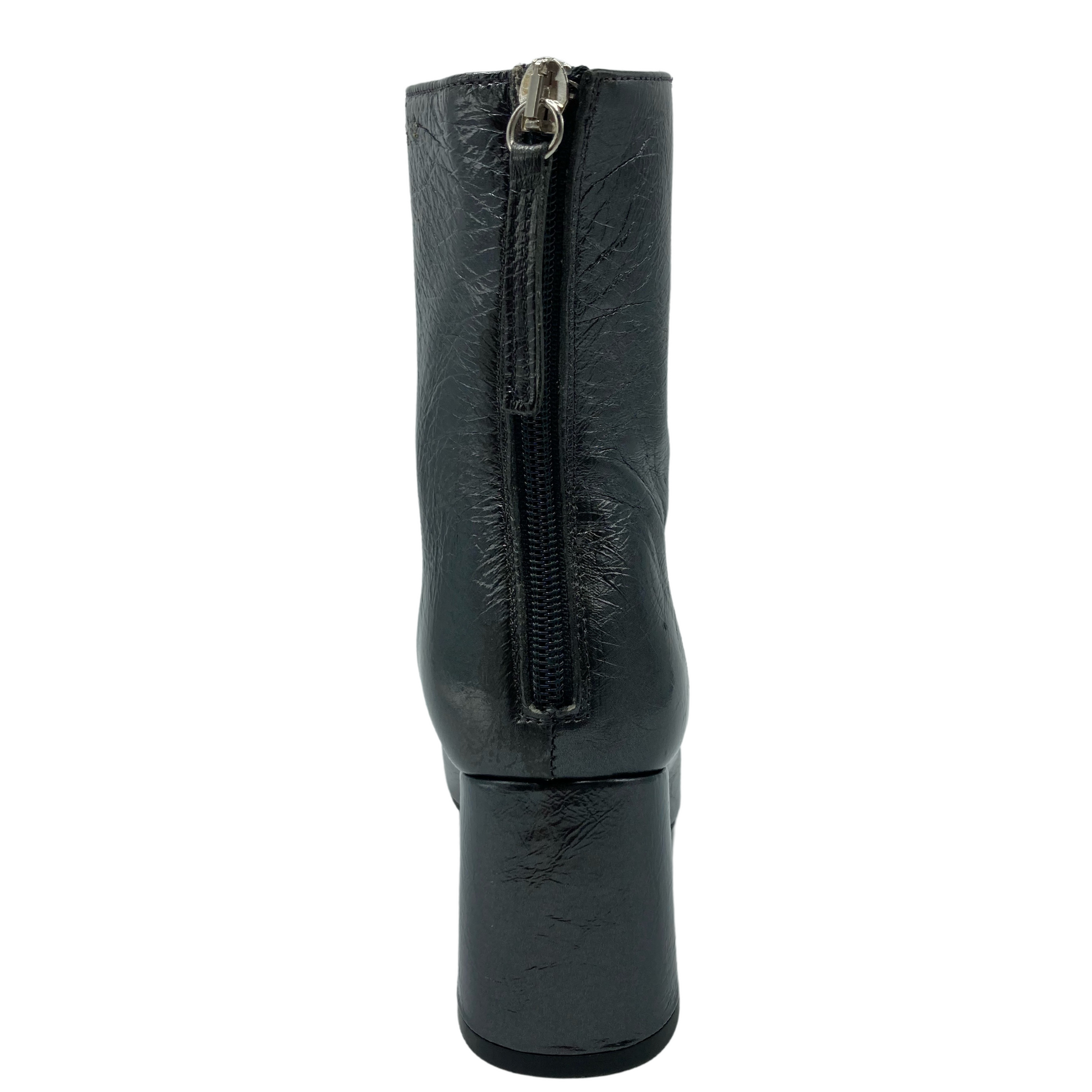 Back view of textured leather short boot with back zipper closure and block heel