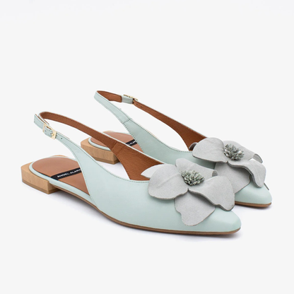 Light blue slingback shoes with floral details on a white background
