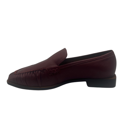 Left facing view of ruby red leather loafer with block heel and square toe