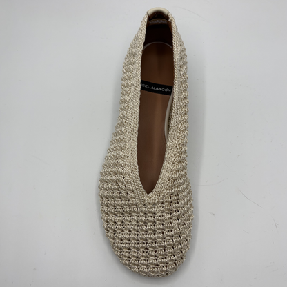 Beige crochet flat shoe on a white background