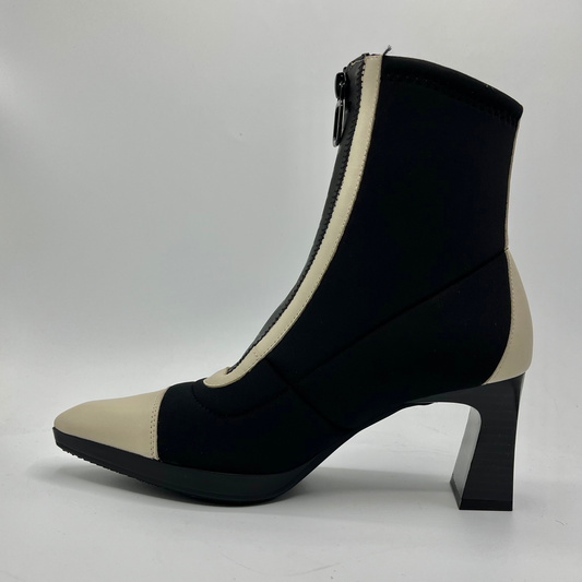 Black and beige ankle boot on a white background
