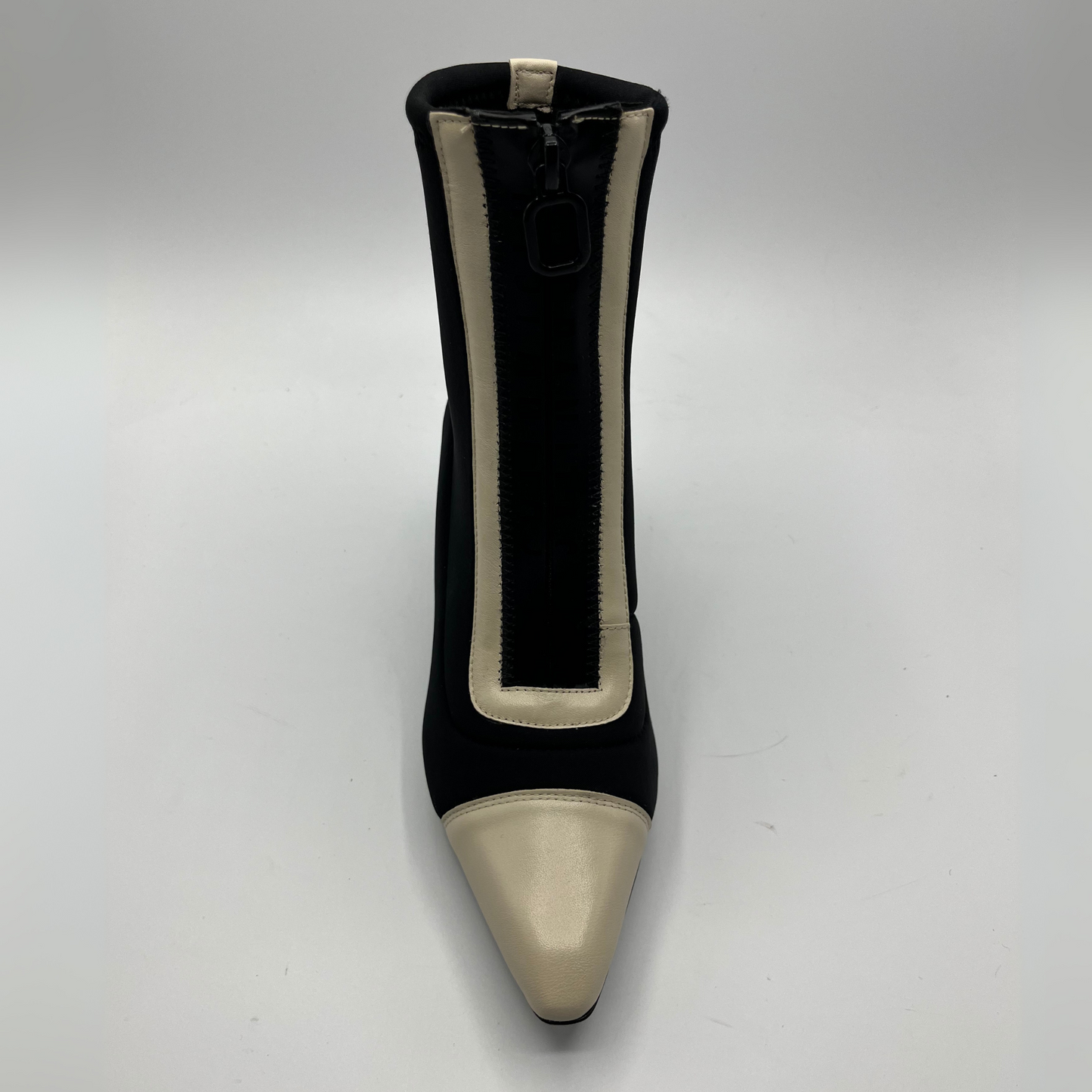 Black and beige shoe on a white background