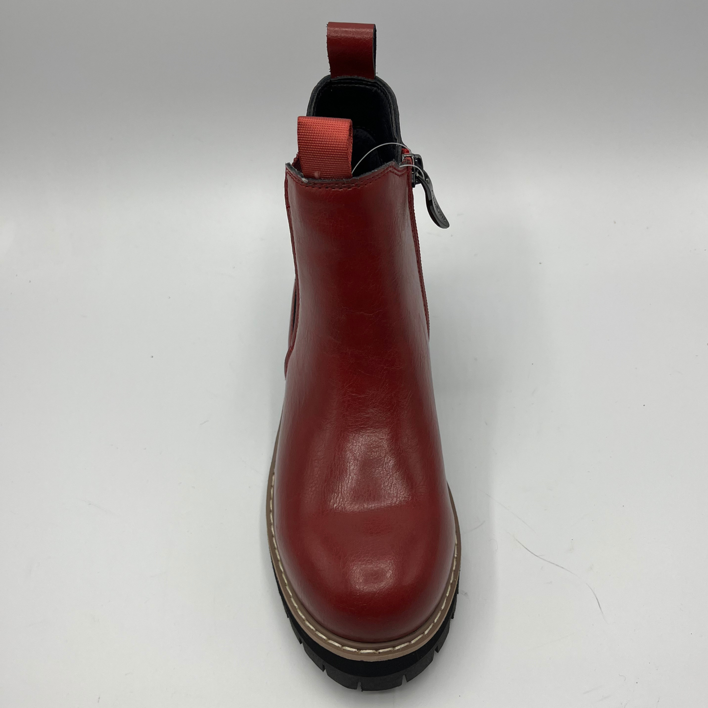 Red leather boot on a white background