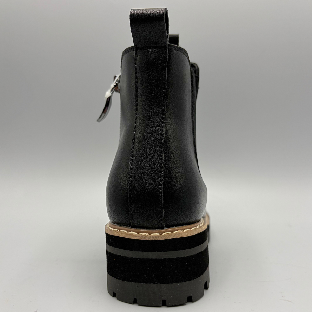Back  view of a black chelsea boot with an elastic side gore