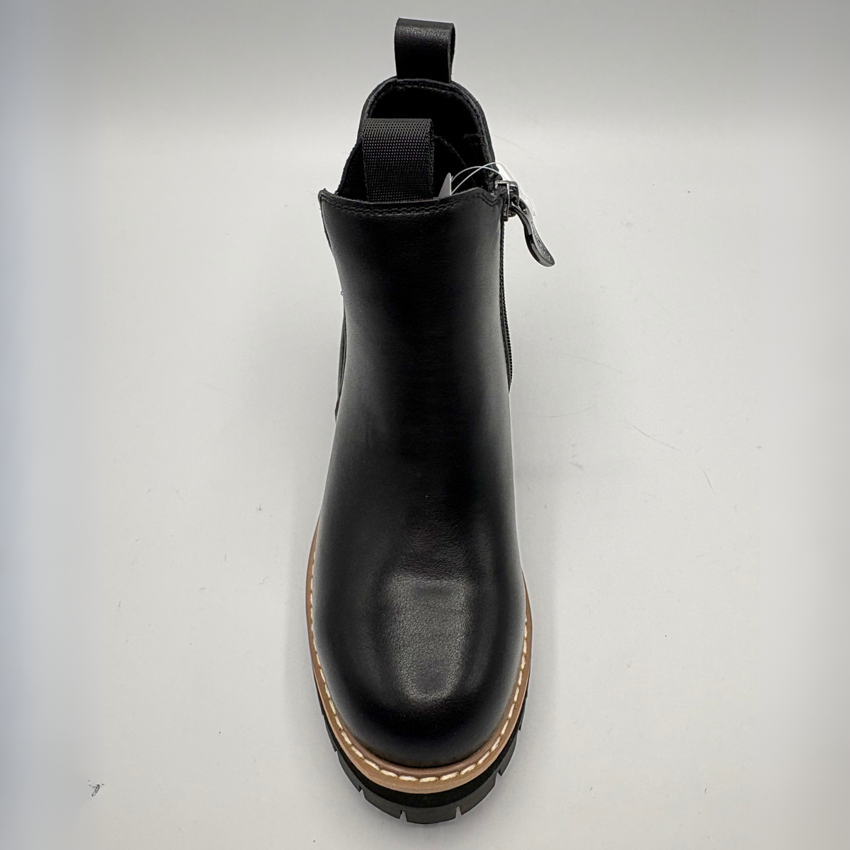 Top view  of a black chelsea boot with an elastic side gore