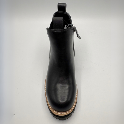 Top view  of a black chelsea boot with an elastic side gore