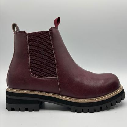 Right  view of a plum chelsea boot with an elastic side gore