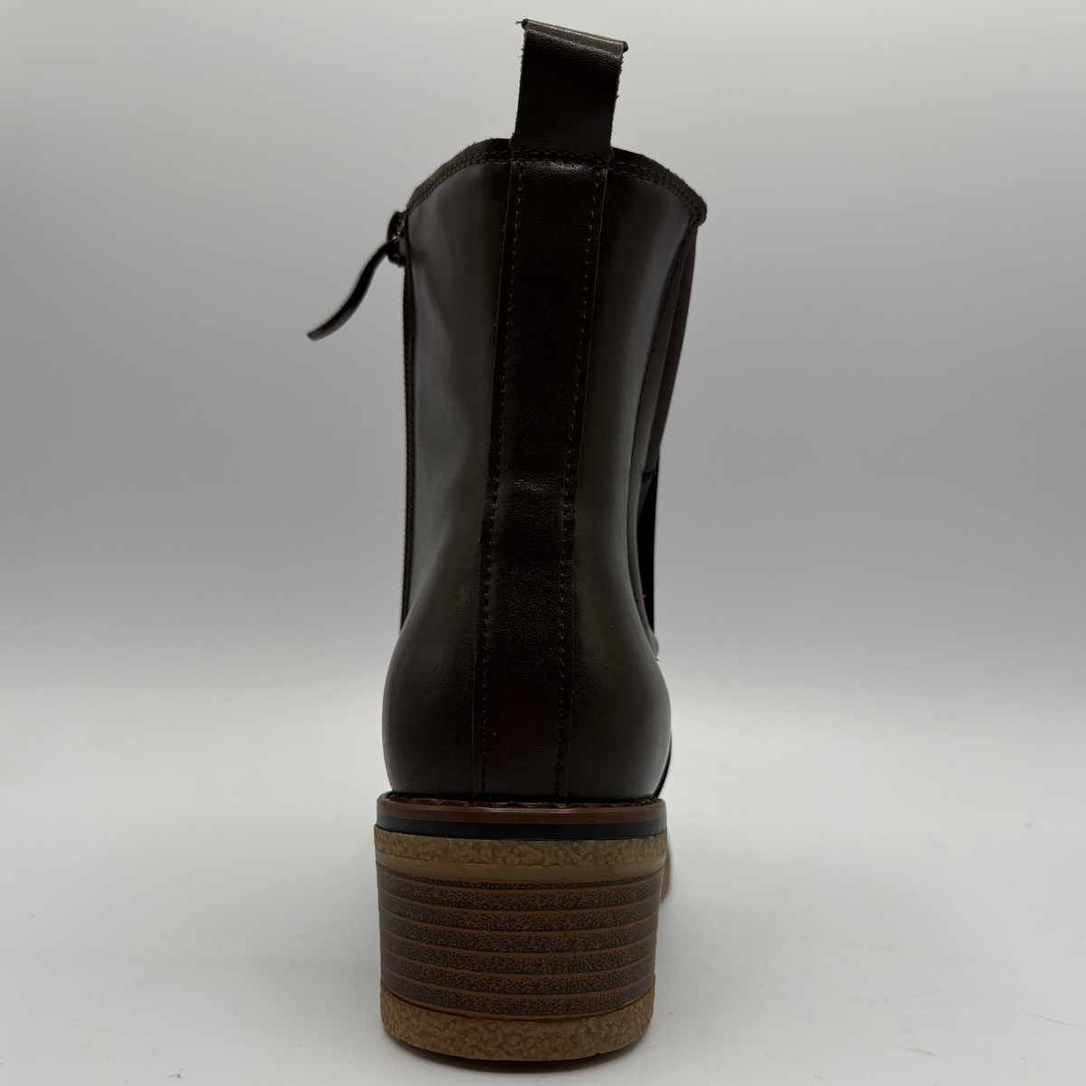 Back facing view of a brown chelsea boot with a pull on heel tab