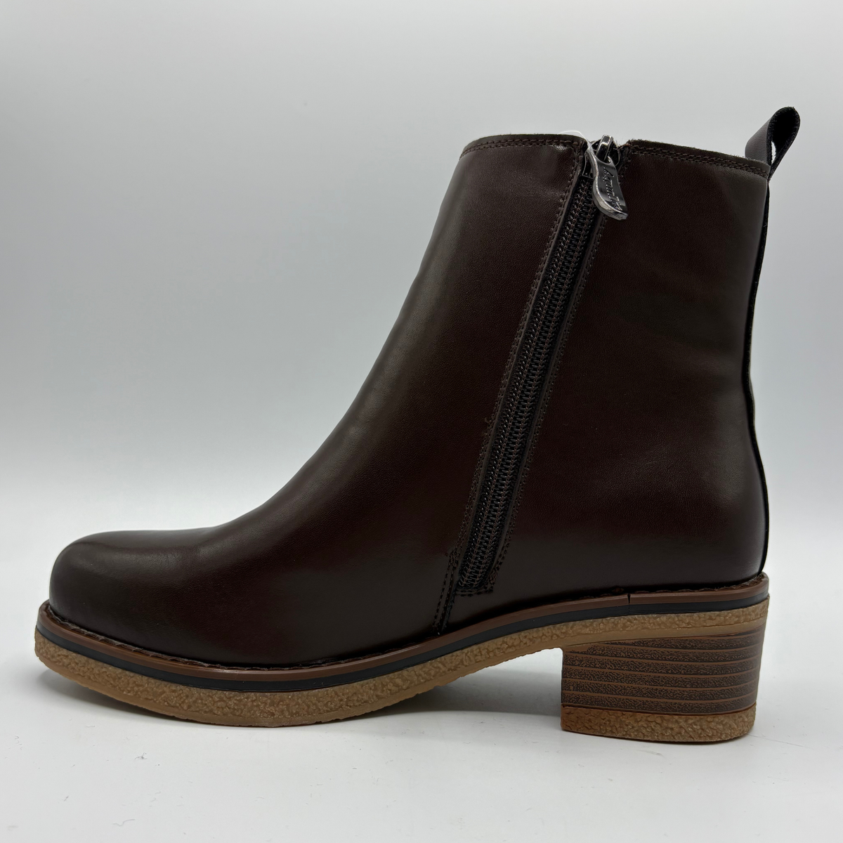 Left  facing view of a brown chelsea boot with a pull on heel tab
