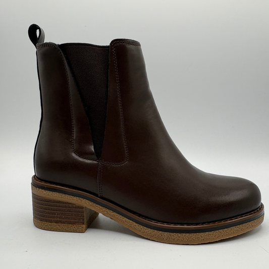 Right facing view of a brown chelsea boot with a pull on heel tab