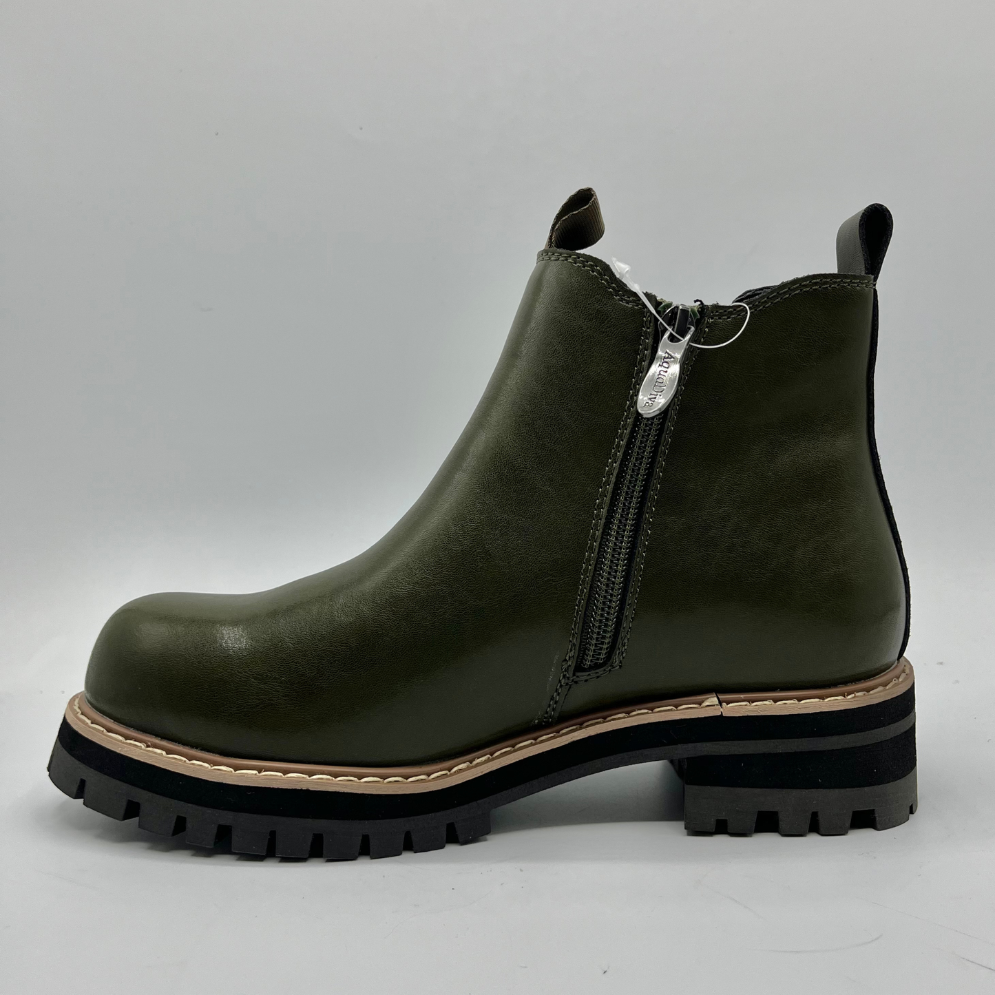 Green ankle boot with a zipper on a gray background