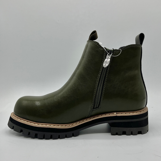 Green ankle boot with a zipper on a gray background