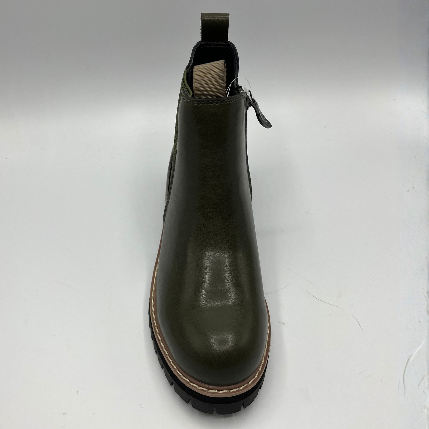 Green Chelsea boot on a white background