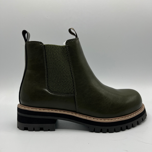 Green Chelsea boot on a light gray background