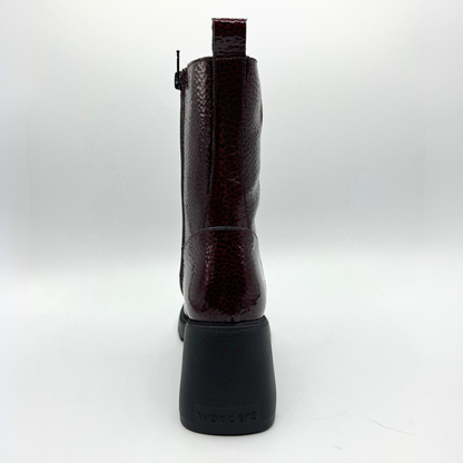 Black leather boot on a white background
