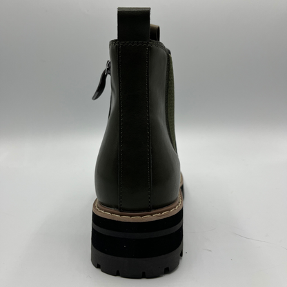 Green ankle boot on a white background