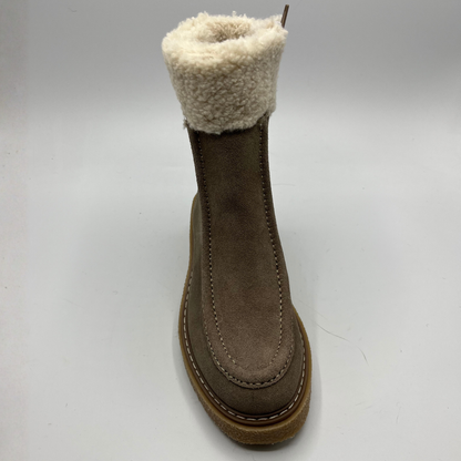 Brown boot with white fur lining on a light gray background