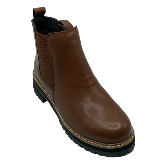 45 degree angled view of brown leather short boot with rounded toe and black rubber sole